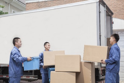 Removal team preparing a local move in Lambeth with boxes and furniture