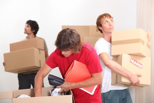 Packed boxes and furniture prepared for loading during a Lambeth home removal