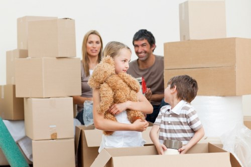 Relocation crew handling boxes and furniture during a Lambeth move